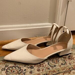 White low heel dressy shoes. They are from SHEIN. They are a size 5.